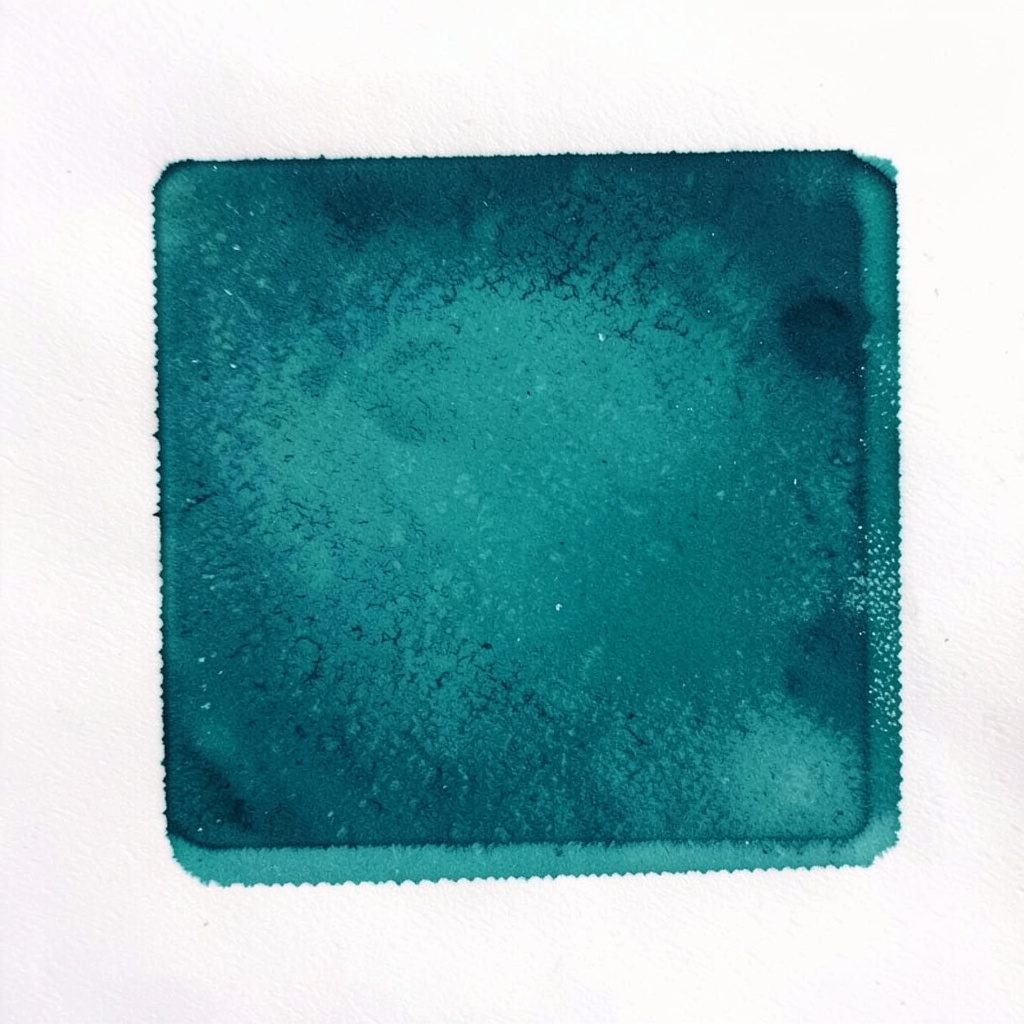 Risograph teal dengan sapuan halus pada kertas putih